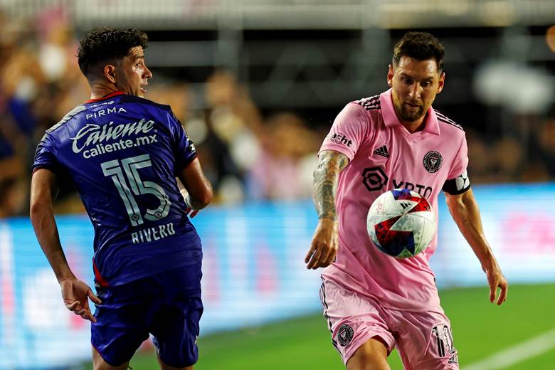 Two men playing football on a field

AI-generated content may be incorrect.